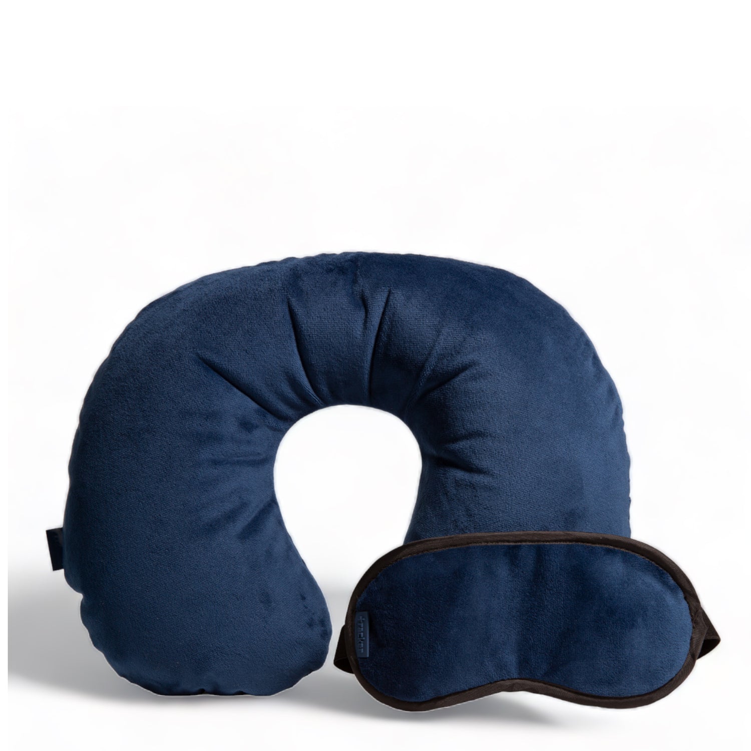 Navy blue travel pillow and eye mask designed by Tracker showing their plush fleece textures, and both are leaning on each other.