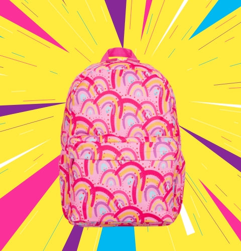 Pink backpack with a print of yellow, purple, and fuscia rainbows on a yellow background that has fun, pink, purple, and light blue obtuse triangles 