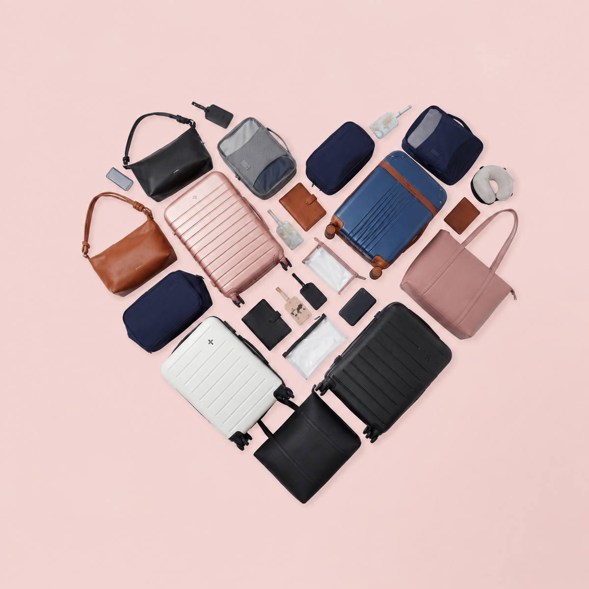 Bentley Collection of various bags and travel accessories arranged in a heart shape on a pink background