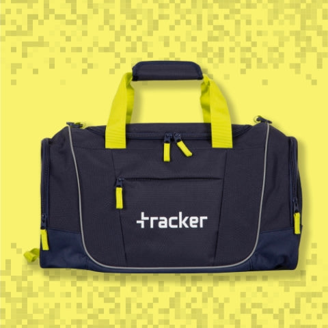 Black and yellow duffle, sports, or gym bag with the tracker logo on the front on a yellow pixelated background, showcasing its top handles, side pockets, front pockets, and main compartment. 